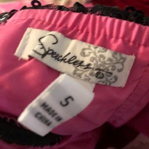 Short black and pink prom dress.